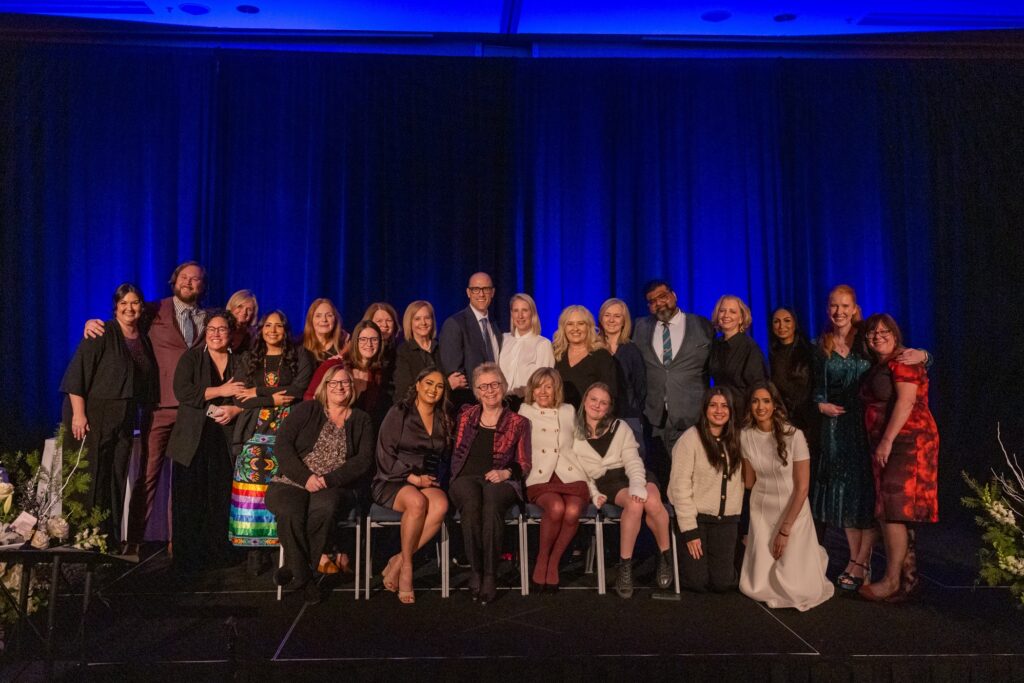 All winners sitting together on stage at the 2024 Nursing Awards